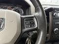 Close-up of the steering wheel control panel of a 2012 Dodge Ram 5500 featuring buttons for cruise control and vehicle functions