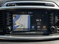 Dashboard display of a 2017 Kia Sorento showing navigation map and radio information