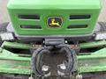 A 2009 John Deere 2653B Precision Diesel Mower featuring a green body with a yellow Deere logo and two black hoses at the front
