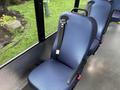 A blue and black bus seat with a safety belt installed