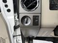 Close-up of the control panel in a 2008 Ford F-250 SD featuring knobs for various settings including lighting and a vent adjustable dial