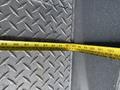 A 2017 Ford F-550 with a yellow measuring tape laid across a textured metal surface
