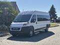A 2020 RAM ProMaster 3500 van with a white exterior and large windows parked diagonally on a driveway
