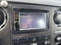 Interior view of a 2015 Ford F-550 dashboard with a Kenwood touchscreen display and control knobs