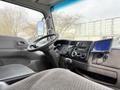 Interior view of a 2008 International CityStar with a steering wheel dashboard controls and a mounted display screen