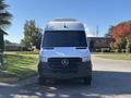 A 2021 Mercedes-Benz Sprinter 2500 with a white exterior and black front grille is parked facing forward