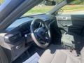 Interior of a 2020 Ford Explorer showing the steering wheel dashboard and driver's seat with controls and display features visible