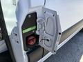 Close-up of the fuel cap on a 2023 Mercedes-Benz Sprinter 2500 showing a diesel nozzle and warning labels