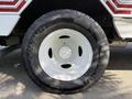 A white wheel with a circular five-bolt pattern and a black tire labeled Airstun on the sidewall