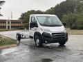 A 2023 RAM Promaster 3500 chassis cab in a silver finish with a closed front and open back for cargo or custom fittings