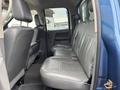 Interior view of a 2006 Dodge Ram 2500 showing the rear seating area with gray leather seats and a clean design