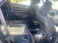 The interior of a 2020 Ford Explorer with the rear seats removed revealing the floor and seating frame