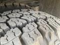 Close-up of a tire tread on a 2011 Chevrolet Express showing detailed patterns and grooves