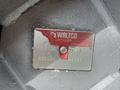 A metal nameplate with the text WALTCO LIFT CORP capacity details and a serial number attached to a surface on the 2022 International MV607