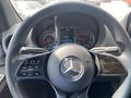 The steering wheel and dashboard of a 2024 Mercedes-Benz Sprinter with control buttons and digital displays