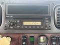 The image shows the dashboard of a 2010 Freightliner M2 106 featuring an MP3 player with a digital display showing the time and various control buttons