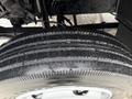 Close-up of a tire from a 2015 Hino 195 showing detailed tread patterns and grooves on the rubber surface