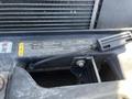 A close-up view of the engine compartment with a focus on a label detailing specifications and instructions for a 2016 Ford F-250 SD