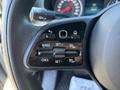 Steering wheel control panel of a 2024 Mercedes-Benz Sprinter 2500 featuring various buttons for cruise control settings