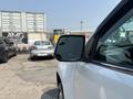 A 2017 Chevrolet Colorado with a focus on the side mirror reflecting a nearby vehicle