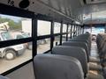 Interior view of a 2007 Freightliner B2 school bus showing rows of grey seats and large windows