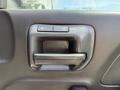 A close-up of a black door handle for a 2016 Chevrolet Silverado 2500HD featuring buttons for locking and unlocking the door