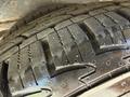 Close-up view of a tire tread pattern on a 2020 Chevrolet Express showcasing deep grooves and detailed texture