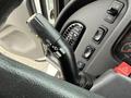 A close-up of the control stalk of a 2005 Freightliner M2 106 featuring switches for headlights and a button for activating the flashers