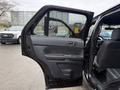 A 2019 Ford Explorer with the front door open showing the interior and door panel details