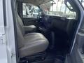 Interior view of a 2022 GMC Savana showing the driver's seat and dashboard with a modern design and control panel