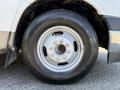 Close-up of a silver wheel rim mounted on a black tire with the brand name General Tire visible on the sidewall