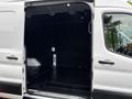 2020 Ford Transit 250 with an open side door revealing a spacious empty cargo area