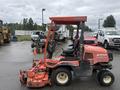 A 2015 Kubota F3990, a compact lawn mower with a red frame, two seats, and a large mowing deck attached in the front