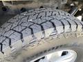Close-up of a treaded tire from a 2015 Ford F-150 showcasing its detailed patterns and rugged design
