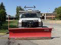 A white 2008 Ford F-450 Super Duty truck equipped with a red Western snow plow mounted on the front