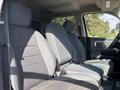 Interior of a 2014 RAM 5500 showcasing two front seats and a center console with a clean and spacious layout