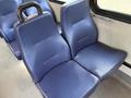Two blue vinyl seats from a 2020 Chevrolet Express van with a textured surface and a simple, modern design