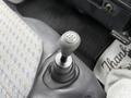 Gear shift lever of a 2001 Toyota Dyna with a gray knob displaying gear markings