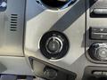Close-up of the control knob on a 2012 Ford F-350 SD dashboard used to select drive modes including 2H 4H and 4L