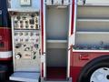 A red and silver fire truck with visible controls including gauges switches and compartments for equipment