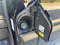 Close-up of the fuel door of a 2025 Ford Transit T-350 showing the cap and warning label inside
