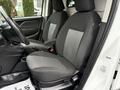 Interior of a 2017 RAM ProMaster City showing two cloth seats with a mix of gray and black fabric design