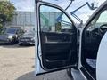 A 2013 RAM 5500 with an open driver's door showing the interior features like seats and control panel