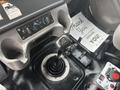 A 2006 Freightliner M2 106 gear shift lever is prominently displayed with various control knobs and a thank you note on the floor near the driver's seat