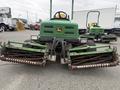 A green 2009 John Deere 2653B Precision turf mower with dual cutting reels in the foreground