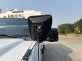 A 2009 Ford F-550 truck showing the side mirror and part of the front of the vehicle