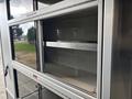A 2020 Mercedes-Benz Sprinter 2500 displaying open storage compartments with a silver frame and two empty shelves inside