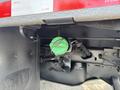 Green cap on a fluid reservoir located underneath a 2013 RAM 5500 vehicle