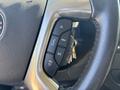 Steering wheel control buttons in a 2019 GMC Savana showing various icons for audio and navigation features