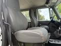 Interior view of a 2008 International 4300 showing the driver's seat and passenger seat with fabric and vinyl upholstery